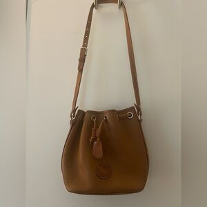 Dooney & Bourke Pebble Grain Small Bucket Bag with drawstring closure.